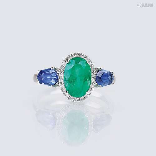 An Emerald Sapphire Ring with Diamonds.