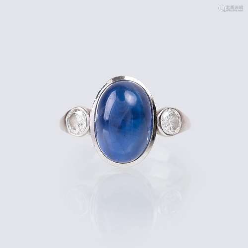 A Sapphire Cabochon Ring.