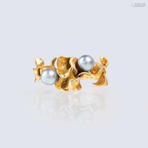 A Gold Ring with Pearls.