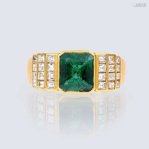 An Emerald Diamond Ring.