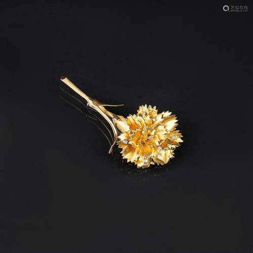 A Flower Brooch with small Diamonds.