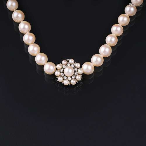 A Pearl Necklace with Diamond Clasp.