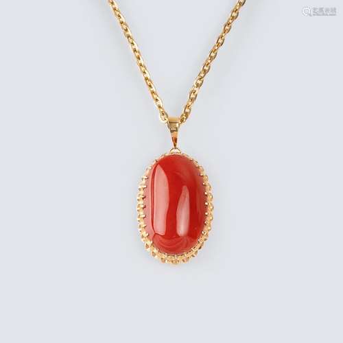 A large Coral Pendant on Necklace.