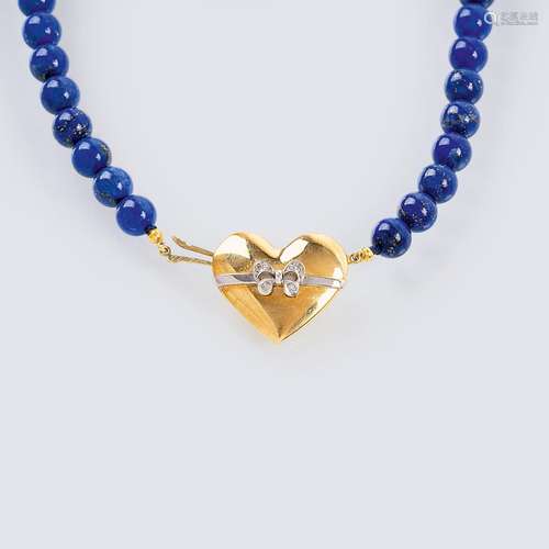 A Lapis Lazuli Necklace with golden Heart Clasp.