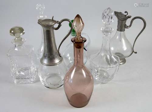 Konvolut aus 7 Glaskaraffen / A set of 7 glass carafes, 20. ...