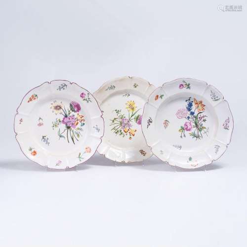 A Set of Three Plates with Fine Floral Bouquets.