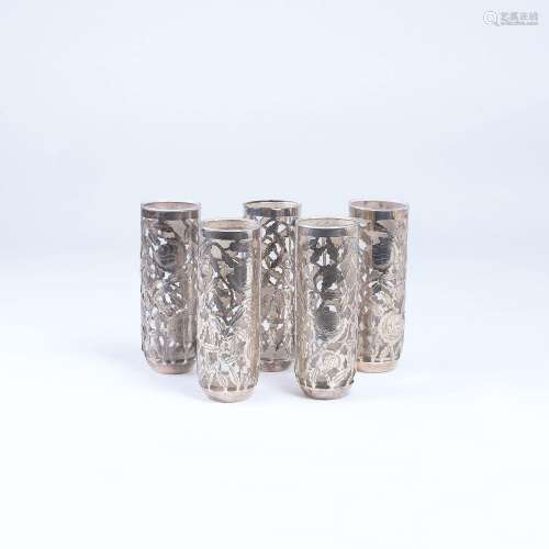 A Set of 5 Mugs with Floral Overlay.