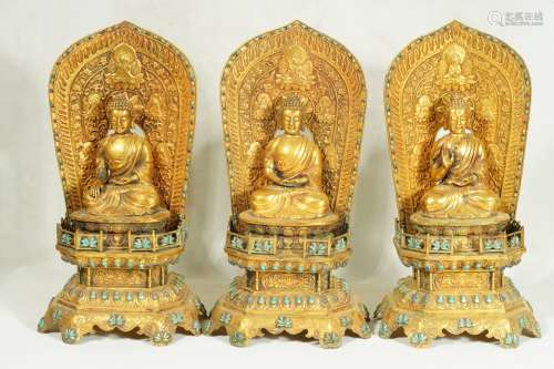 A set of three GILT-DECORATED FIGURES