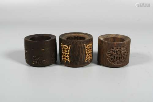Three Agarwood Thumb Rings, China