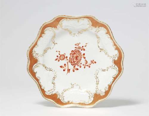 A Meissen porcelain dinner plate from a service with iron re...