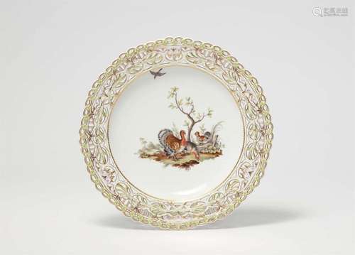 A Berlin KPM porcelain dessert plate from a service with ani...