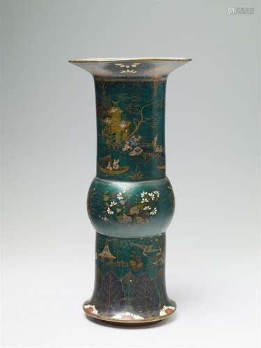 A large, green lacquered faience vase