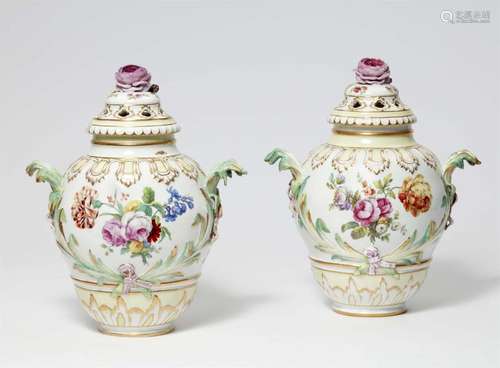 A pair of Berlin KPM porcelain potpourri vases with naturali...