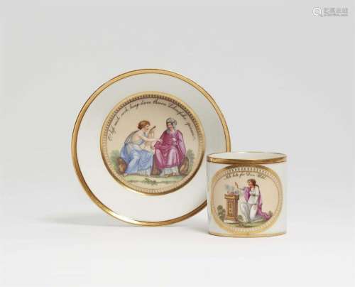 A Berlin KPM porcelain cup with the Three Fates
