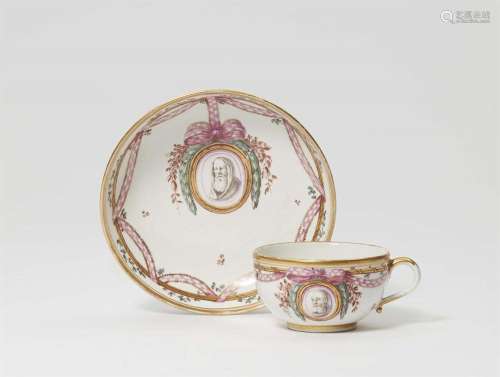 A Nymphenburg porcelain cup and saucer with three portraits