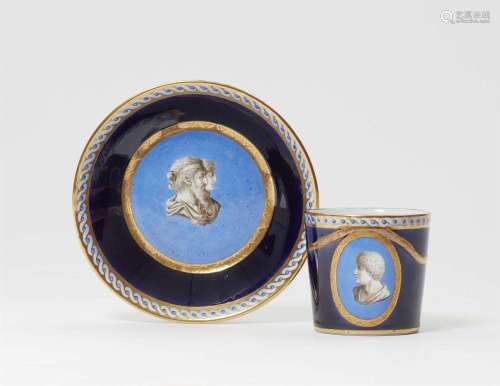A porcelain cup and saucer with Neoclassical busts