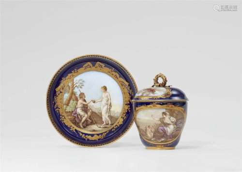 A Meissen porcelain cup and saucer with scenes after Angelik...