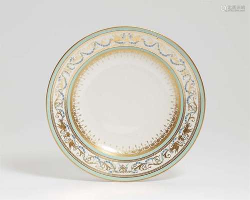 A Vienna porcelain plate with arabesque and carnation decor