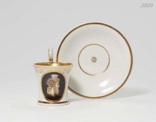 A Berlin KPM porcelain cup and saucer with faux cameo decor