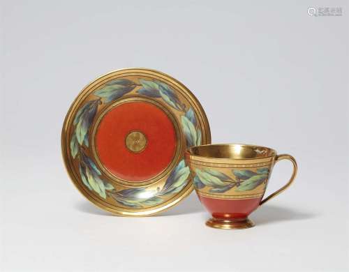 A Berlin KPM porcelain cup and saucer with laurel wreaths