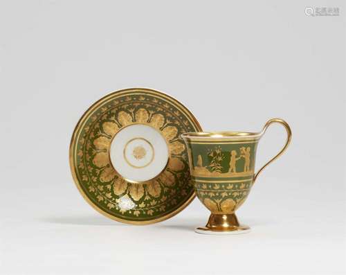 A Berlin KPM porcelain cup and saucer with children at play