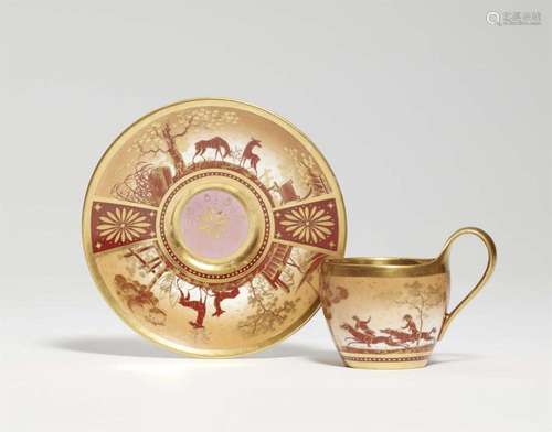 A rare Berlin KPM porcelain cup with a hunting scene