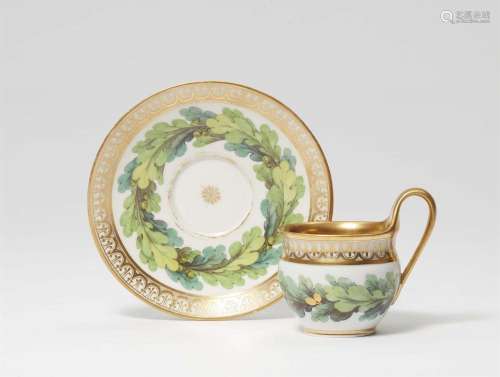 A Neoclassical Berlin KPM porcelain cup and saucer with oak ...