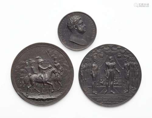 Three cast iron medallions commemorating the German Campaign...