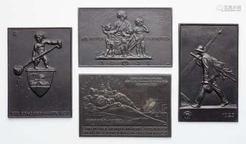 Four cast iron commemorative and New Year s plaques