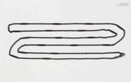 A long cast iron chain necklace