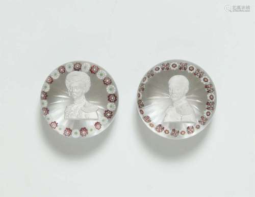 Two glass paperweights with portraits of Tsars