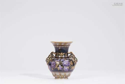 A Berlin KPM porcelain vase with rams  heads and raised enam...