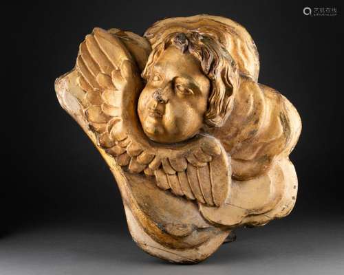 Tête d'angelot dans les nuées <br />
Bois sculpté et doré <b...