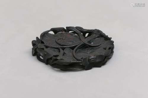 A CHINESE WOOD 'LOTUS LEAVES' STAND. 19th / 20th Century. Th...