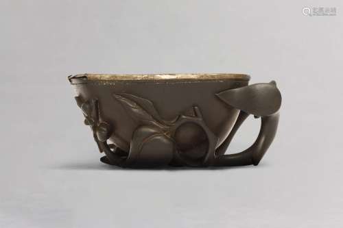 A CHINESE HARDWOOD 'PEACHES' LIBATION CUP. Qing Dynasty