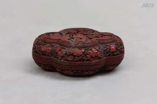 A CHINESE CINNABAR LACQUER QUATREFOIL BOX AND COVER. Qing Dy...
