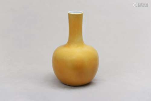 A CHINESE LEMON-YELLOW GLAZED BOTTLE VASE. Qing Dynasty. The...