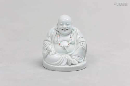 A CHINESE BLANC-DE-CHINE FIGURE OF BUDAI HESHANG. Qing Dynas...