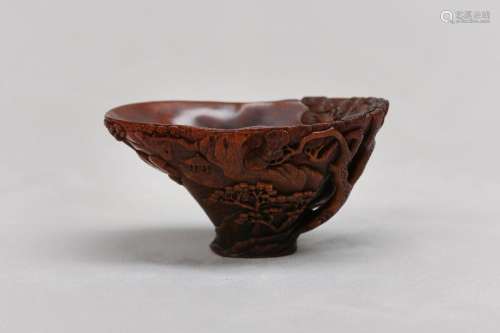 A CHINESE RHINOCEROS HORN ‘RIVER LANDSCAPE’ LIBATION CUP. 17...