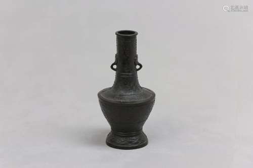A CHINESE BRONZE VASE. Yuan Dynasty. The body swelling to th...