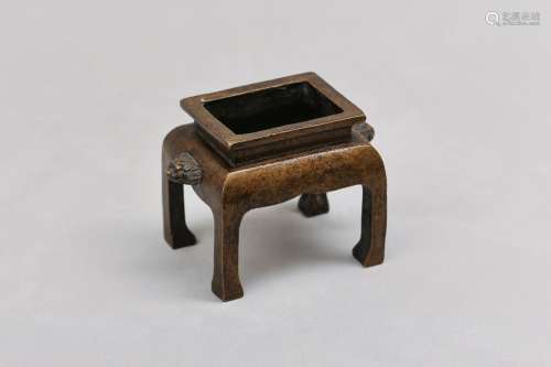 A CHINESE BRONZE INCENSE BURNER. Qing Dynasty. The arched re...
