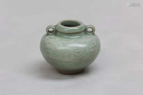 A CHINESE CELADON-GLAZED JARLET. Song Dynasty. Of tapered ov...