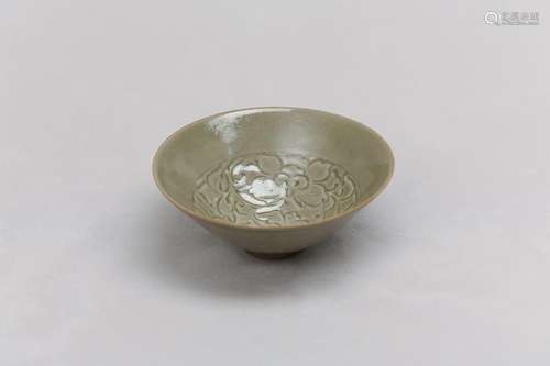 A CHINESE YAOZHOU CELADON-GLAZED BOWL. Song Dynasty. Of slig...