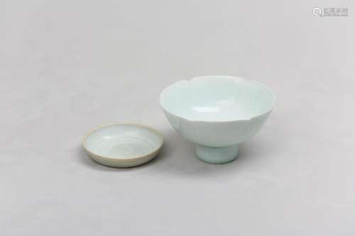A CHINESE QINGBAI FOLIATE STEM BOWL AND SAUCER. Song Dynasty...