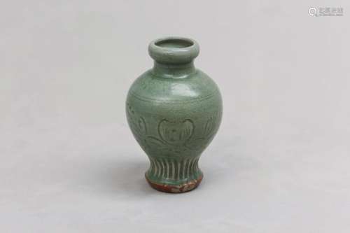 A CHINESE LONGQUAN CELADON VASE. Ming Dynasty. Decorated wit...