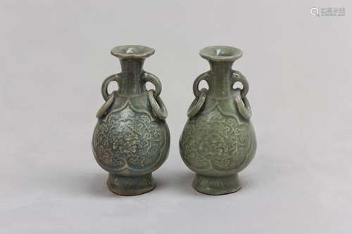 A PAIR OF CHINESE CELADON-GLAZED BOTTLE VASES. Yuan / Ming D...