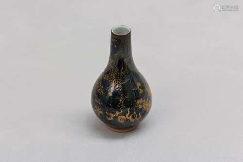 A CHINESE GILT-DECORATED BLACK-GLAZED 'DRAGON' VASE. Qing Dy...