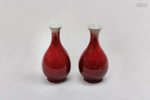 A PAIR OF CHINESE COPPER RED-GLAZED VASES. Qing Dynasty. Eac...