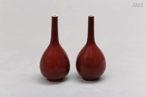 A PAIR OF CHINESE COPPER RED-GLAZED VASES. Qing Dynasty. Eac...