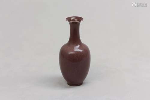 A CHINESE AUBERGINE-GLAZED 'DRAGON' BOTTLE VASE. With an ovo...